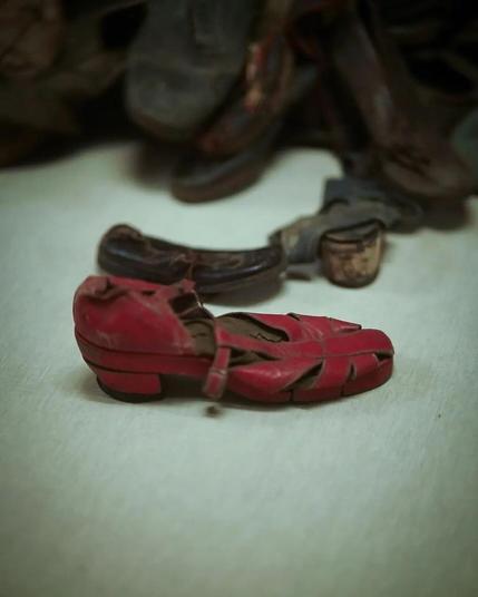 A red leather female sandal.