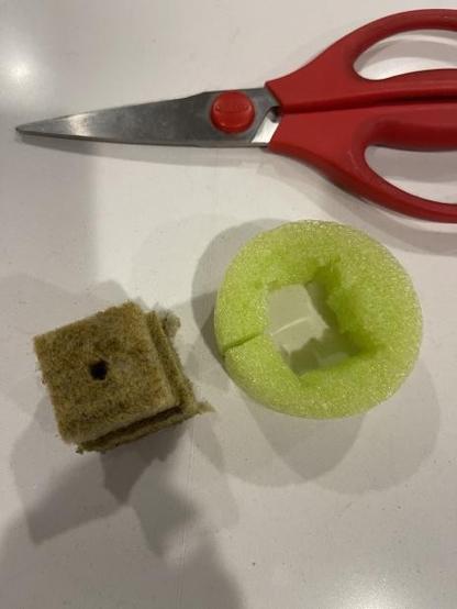 cutting a square out of the pool noodle center to fit the rockwool.