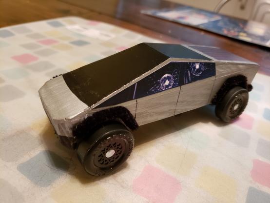 Pinewood Derby model of a Tesla Cybertruck, complete with “bulletproof windows”
