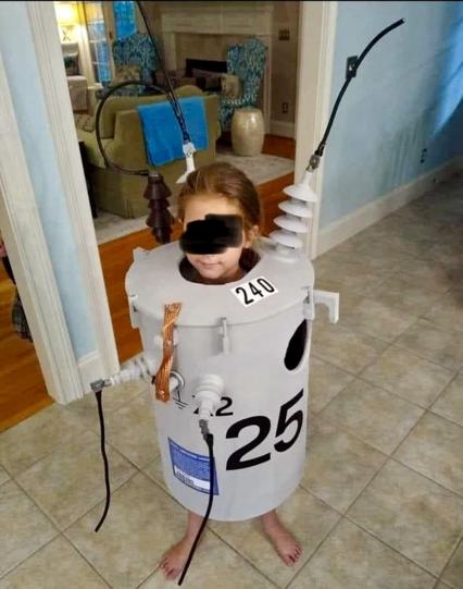 kid in a kistume what looks like an elktrical transformer