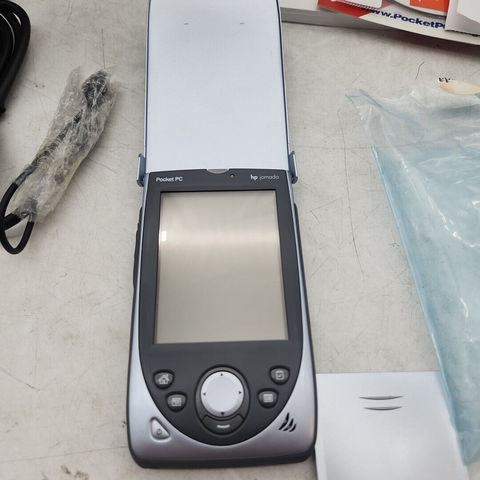 Image of an HP Jornada 568 Pocket PC with a clamshell lid in the open position, showing the display in portrait orientation, a circular directional pad.