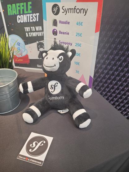 Pony plush toy with Symfony logo. It has stripes concentrated at the extremities.