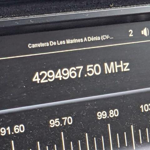 Close up of the digital screen showing the frequency of a radio station, though the numbers don't fit the FM band, 4294967.50 MHz, I think our car radios having a moment