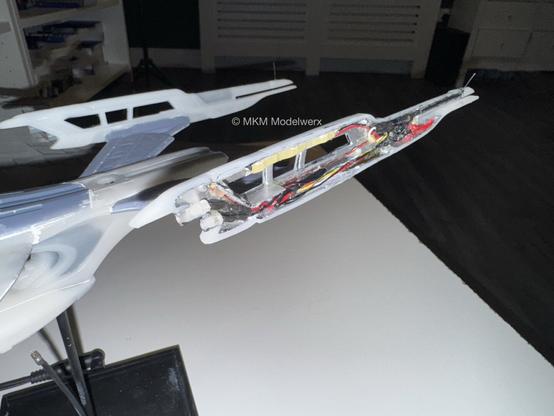 Port nacelle glued into place showing all the cables and LEDs on the inside.