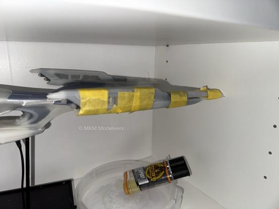 Port warp nacelle wrapped in yellow masking tape