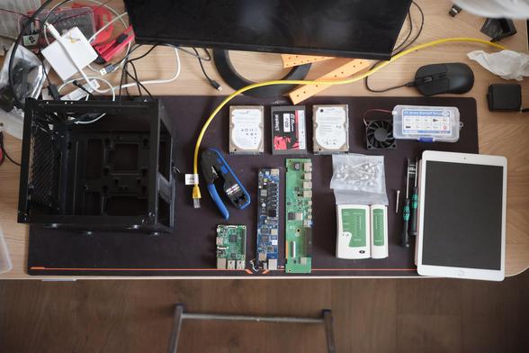 A table with a bunch of computer components and mini