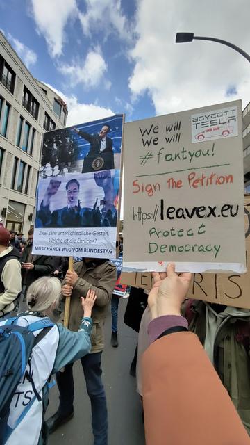 Sign with the famous photo of musk making the nazi salute and supporting AfD