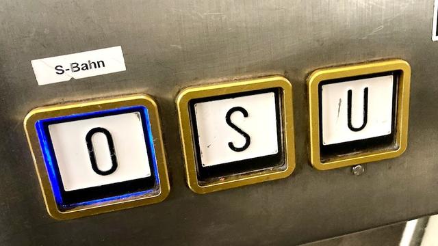 Photo of 3 elevator buttons with huge letters on them: O, S and U. A white label reading "S-Bahn" has been affixed above the O button. O is the right choice for the surface (S-Bahn) trains.
The huge S button takes the unsuspecting visitor to an intermediate floor instead, the actual term for which is only known to the people who build train stations I guess.