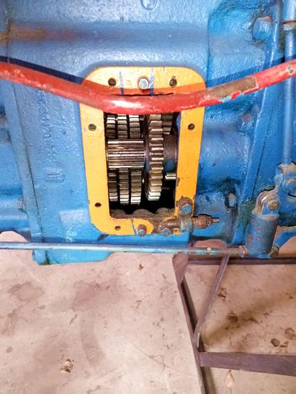 A flap on the gearbox is removed here, exposing the gearwheels inside.