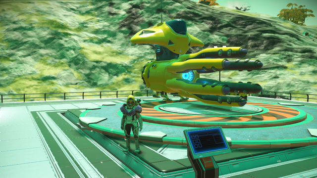 My character standing in front of a star ship that is yellow and has a bunch of forward facing arms reminiscent of a squid