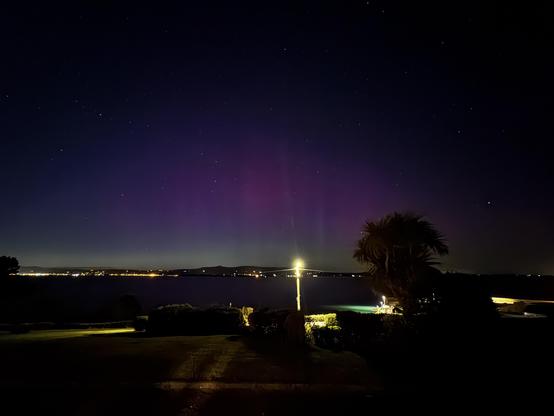 Wide angle shot of aurora over Dungarvan bay looking towards Dungarvan from Helvick. 

Lots of purple and green covering most of the lower sky.