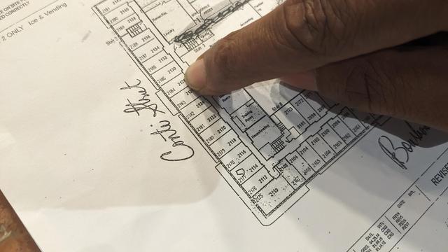 hotel room map with finger pointing