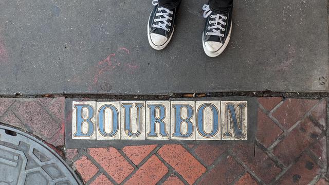 sidewalk bourbon street sign