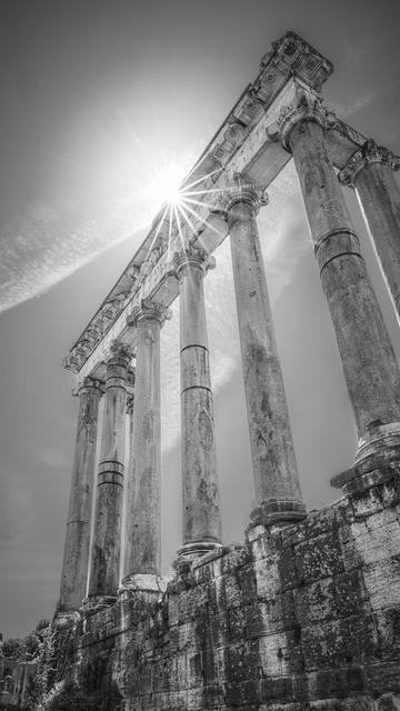 Sunlight streams through the ancient Roman columns, with the sun creating a radiant starburst effect. These are the remains of the Temple of Saturn, an ancient Roman temple to the god Saturn, found in what is now the Roman Forum in Rome, Italy. 

 #rome #italy #forum #temple #saturn #archeology #ancient #historical #blackandwhite #columns #sunstar #historic #ancient #romanforum #ruins #BuyIntoArt #AYearForArt #artforsale #wallartforsale #giftideas @joancarroll 

https://joan-carroll.pixels.com/featured/temple-of-saturn-rome-italy-bw-joan-carroll.html