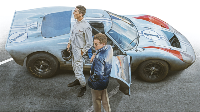 Ken Miles (Christian Bale) and Carroll Shelby (Matt Damon) standing next to a Ford GT40.