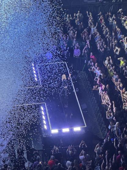 Kylie Minogue at the end of the projected-into-the-audience catwalk at the conclusion of the main set, a sweeping blast of white confetti coming in from the left.
