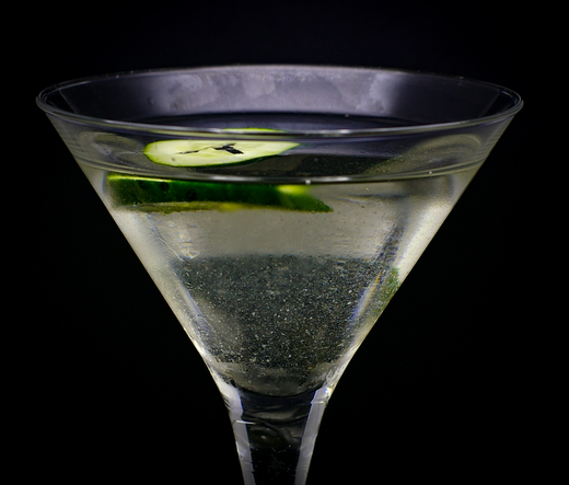 The cocktail itself in a chilled Martini glass and garnish with a slice of cucumber