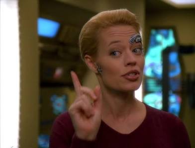 Close up of Seven wagging a finger.