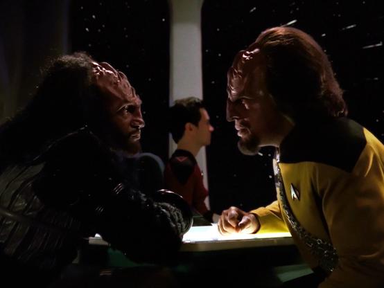 Worf and his brother Kurn sitting at Ten Forward