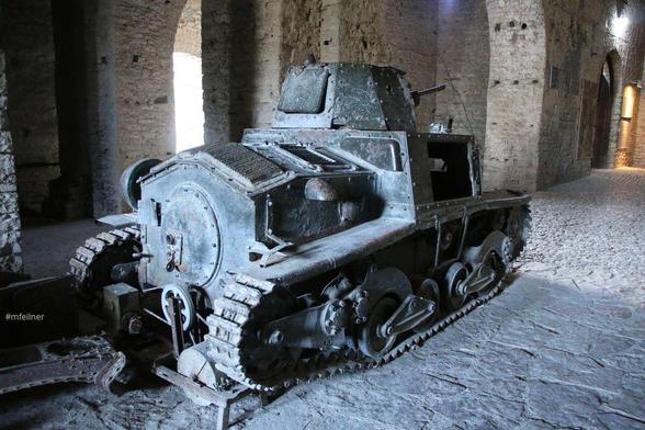 a very small fiat tank in an ancient vault