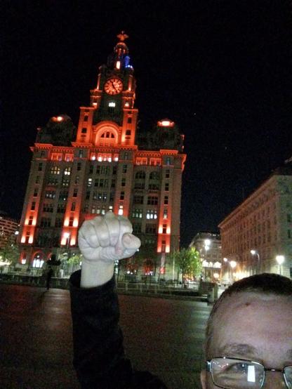 Me with my fist up ok front of the Liver building in Red for us winning the League