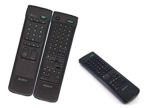 Sony RM-830/831 remote control. The remote is reversible (buttons on both sides) and fits inside a hard sleeve that hides the buttons on the back face. It's a rather large remote.

One side has 52 buttons. The other only 23 (including large program and volume up/down buttons).

I have very stong tactile memories of this remote. I vividly remember the weight, and how the keys, and the motions of reversing it, felt like. Weird...