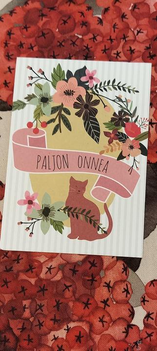 Happy birthday card with a picture of a cat and flowers