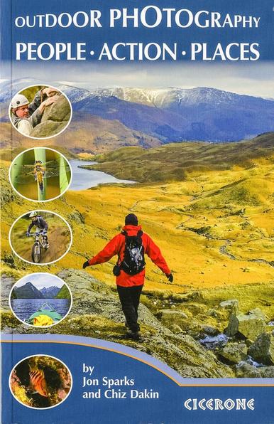 Cover of Outdoor Photography: People—Action—Places by Jon Sparks and Chiz Dakin, published by Cicerone. Main photo is a mountain landscape featuring a walker, back to camera, in red jacket, walking down a rocky outcrop overlooking a golden valley and a tarn with snow-streaked fells beyond. On the left five small photos in circular insets: from top: rock-climber, dragonfly, mountain biker, sea kayaking view in fjord, tropical fish.