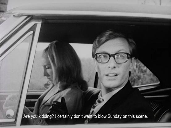 A couple sit in a car. The man is saying, “Are you kidding? I certainly don't want to blow Sunday on this scene."