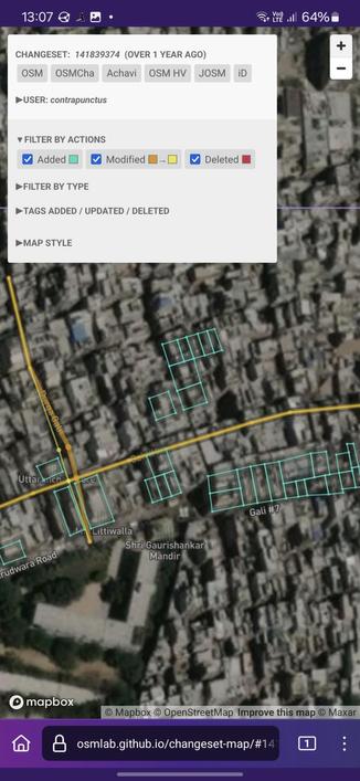 Screenshot of Changeset Map, visualizing the changes made against a satellite imagery background. I've added 31 buildings (shown as blue polygons) near the government school on Gurudwara Road. I've also slightly tweaked the geometry of a street (new geometry in a light yellow, old geometry in a mustard color).