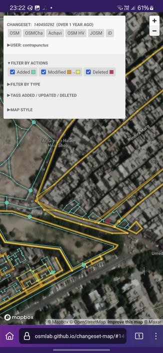 Screenshot of Changeset Map, visualizing the changes made against a satellite imagery background. I've added 7 buildings (shown as blue polygons) along the road. This more zoomed in view also shows that I've added a walking path to an existing park, and a sidewalk outside Deshbandhu Apartments.
