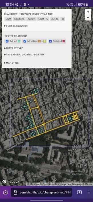 Screenshot of Changeset Map, visualizing the changes made against a satellite imagery background. I've added 25 buildings (shown as blue polygons) near Gurudwara Road. I've also slightly tweaked the geometry of a few streets (new geometry in a light yellow, old geometry in a mustard color).