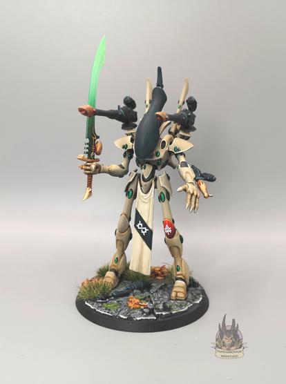 Wraithlord armed with two shoulder mounted brightlances, two wrist mounted flamers and a large sword with a glowing green blade