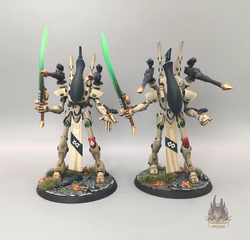 2 Wraithlords each  armed with two shoulder mounted brightlances, two wrist mounted flamers and a large sword with a glowing green blade