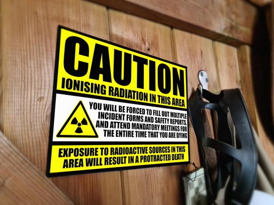 Caution sign:ionising radiation. You will be forced to fill in forms until you die.