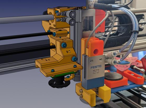 The image fades from a CAD model of a piece of machinery to the real world on the right.  A large number of functional parts of the assembly are 3d-printed and were designed to be optimally printable.