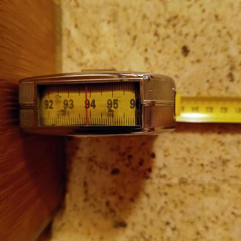 A tape measure that indicates the clear width of a door.