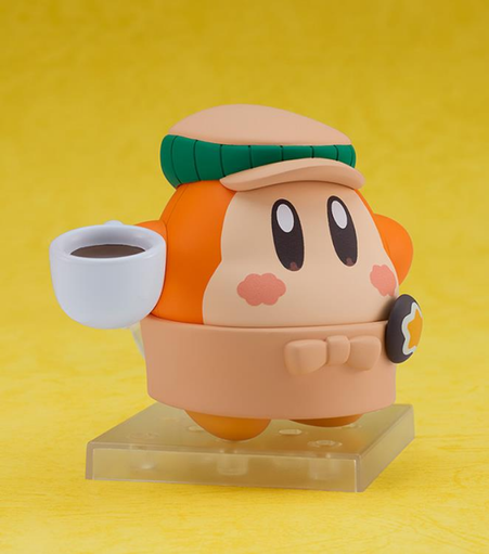a figure, it is a round cute guy , orange and tan with big tall eyes and pink cheeks, wearing a green and tan cap, holding a cup of coffee