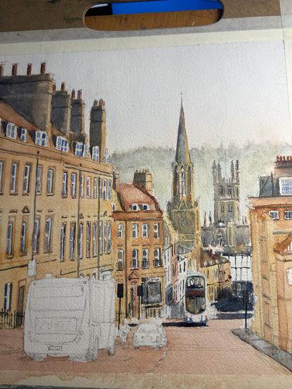 A watercolor painting depicting a street scene with buildings, a church spire, and vehicles. The background features a hazy landscape, and architectural details of the town are prominent. There is a prominent bus driving towards up up the hill in the lower middle of the painting