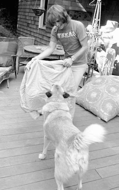 Bob Weir (human) plays with Otis (dog) on their back porch