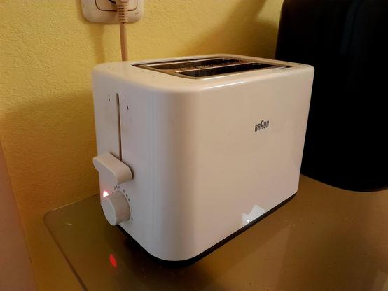 Toast toasting in the toaster, round side down.