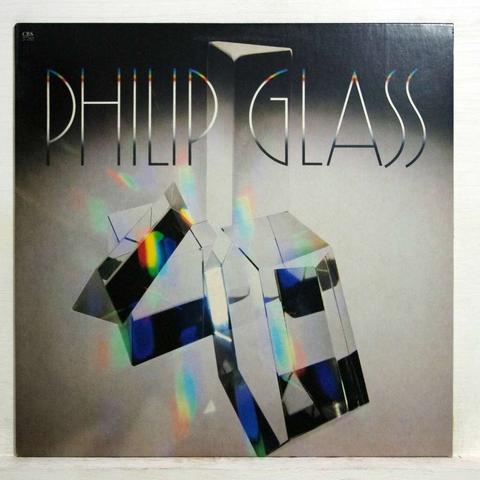 The album art for the Glassworks (1981) album, featuring a complex crystalline structure with the large text PHILLIP GLASS superimposed over the top in an Art Deco style