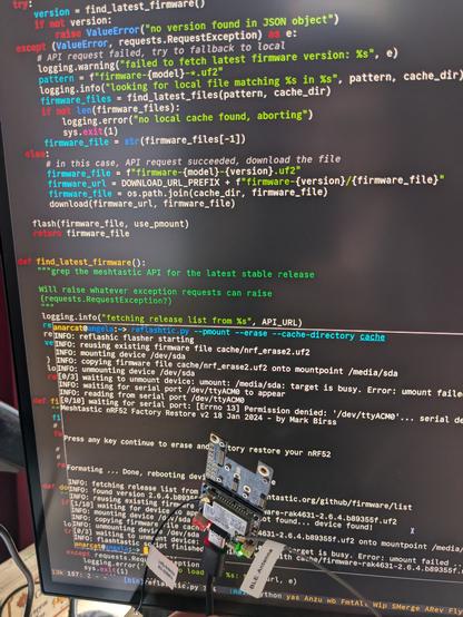 a RAK4631 LoRa board in front of a screen showing a terminal running the `reflashtic.py --pmount --erase --cache-directory cache` command, backed by the reflashstic source code, see the URL for an actual copy of the terminal output