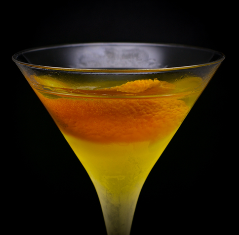 The cocktail itself in a chilled Martini glass and garnish with an orange twist