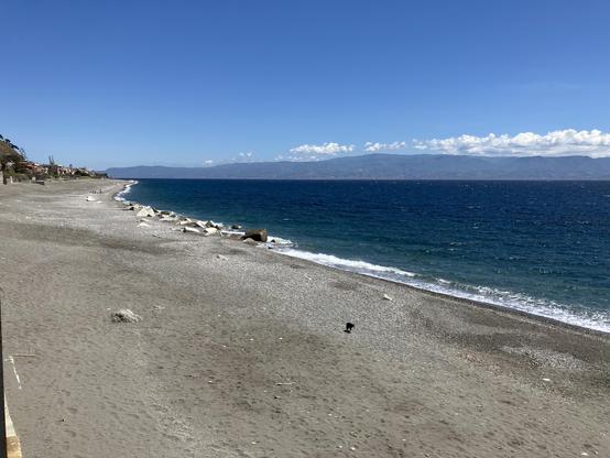 Beach at Giampilieri. Mainland Italy is visible in the distance on the other side of the Strait of Messina.