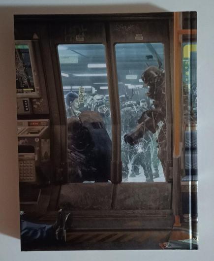 Parte anterior del mismo libro donde se ve el resto del vagón del metro y más imágenes cyberpunk