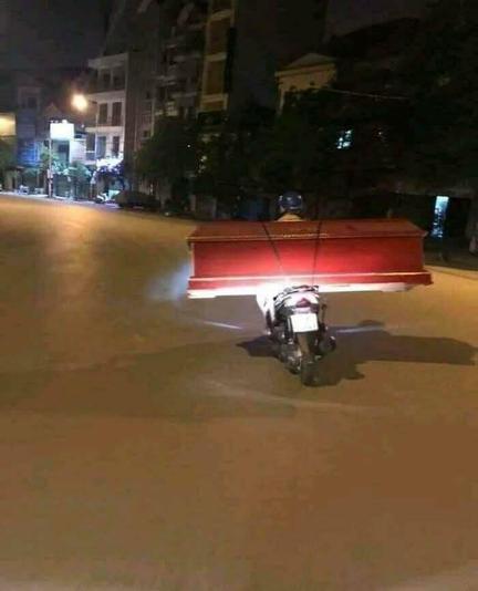 Coffin on the back of motorcycle