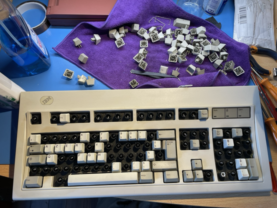 A keyboard being assembled after cleaning, key by key.