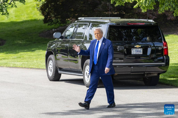 U.S. President Donald Trump walks to board Marine One at White House-Xinhua