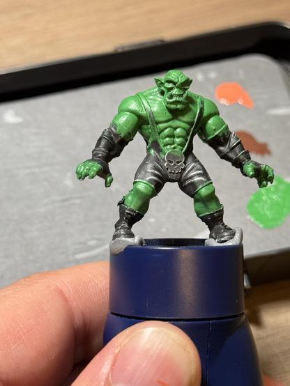The Rumbleslam orc wrestler from the front after the first blocking in of the first base color(green).
